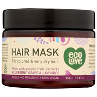 A jar of EcoLove Purple Collection Deep Conditioning Hair Mask on a white background, surrounded by purple flowers. The label reads 'EcoLove Purple Collection Deep Conditioning Hair Mask, free from SLS, parabens, and petrochemicals. 95% nature-derived ingredients (30% organic). Enriched with essential oils, organic herbs & plant extracts, and 26 Dead Sea minerals'.
